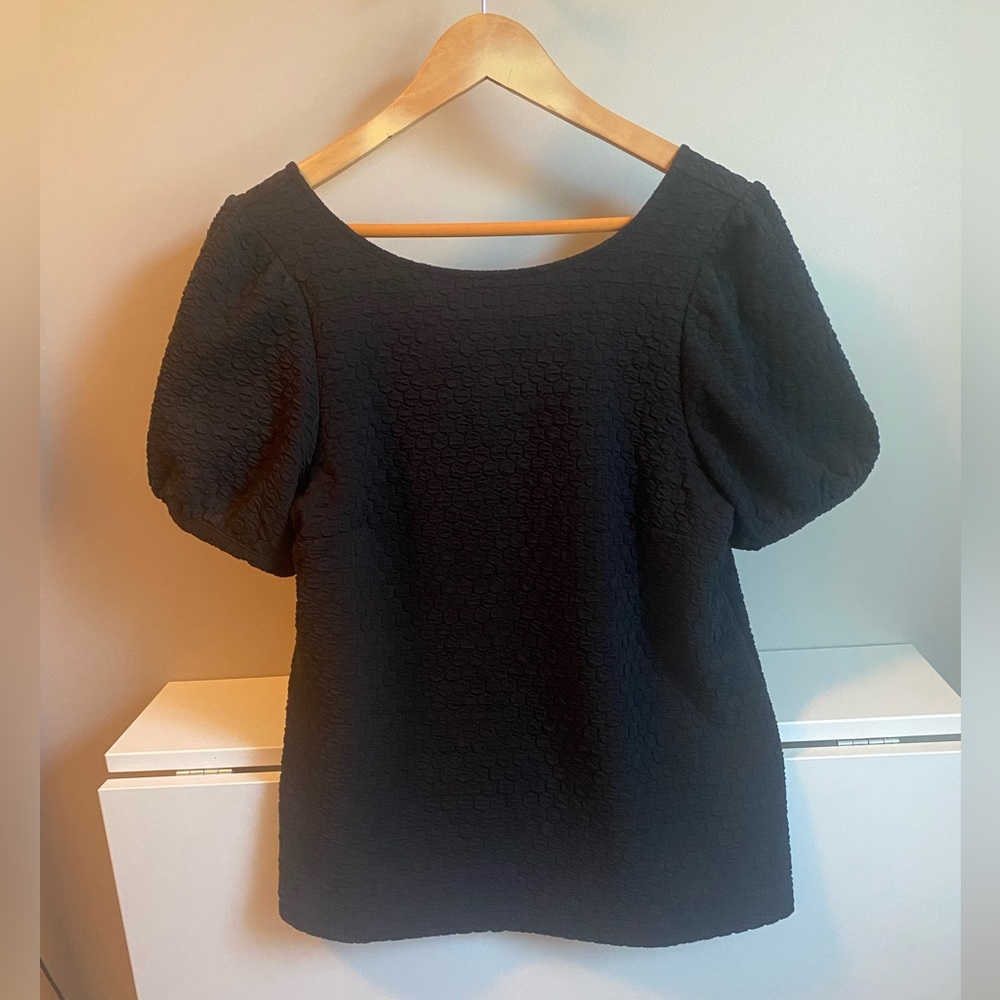 Anthropologie short puff sleeve black top with lower back